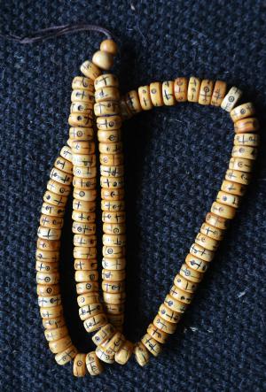 big bone disks carved