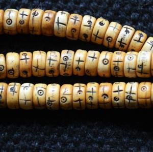 big bone disks carved detail